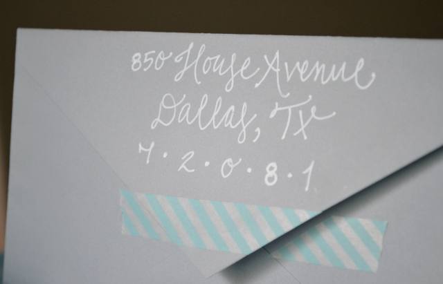 white calligraphy lettering on grey envelope - affordable - with teal washi tape. 