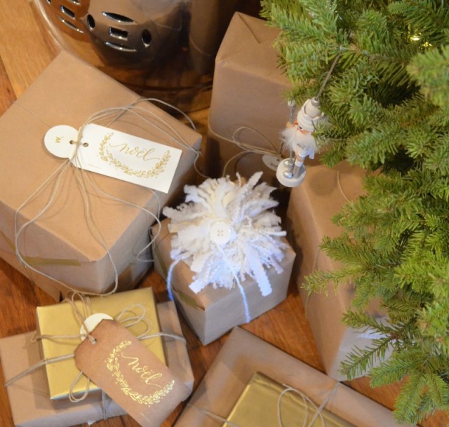 kraft paper, twine and gold wrapped Christmas presents